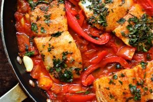 Photo of moroccan salmon with fresh garlic, peppers, and spices in a pan