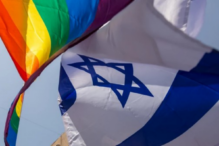 Image of the Israeli flag and the pride flag waving together
