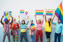 Image of individuals dressed up for a pride event