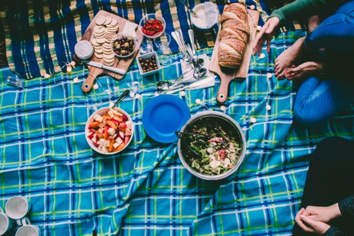 Stock image of a picnic blanket with food