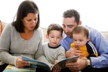 Stock image of a family reading together