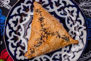 Photo of a samsa - a fried stuffed pastry of Uzbekistani origins