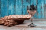 Stock image of table with matzah and a Kiddush cup for Passover