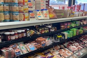 photo of a kosher market stocked shelves with breadcrumbs, meat, passover products and more