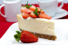 Stock image of cheesecake with strawberries on top