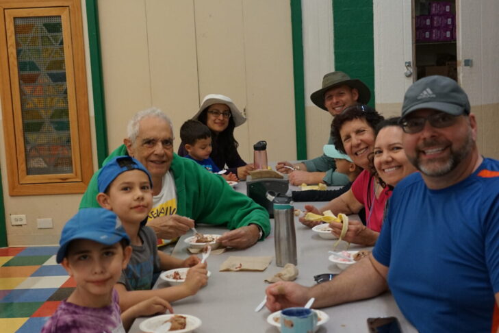 Photo of participants enjoying a snack at PJ Library Family Camp