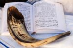 Stock image of a shofar and prayer book