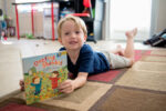 photo of a boy reading "One Fine Shabbat" book from PJ Library