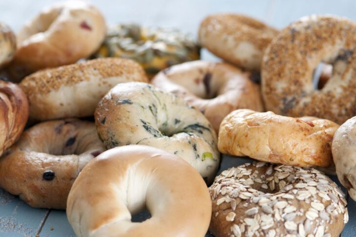 photo of a variety of bagels piled on top of one another