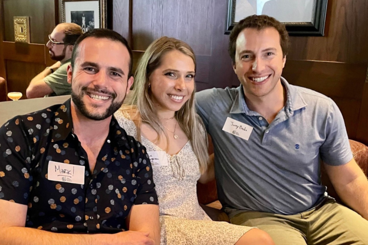 Photo of three young professionals at a networking happy hour event