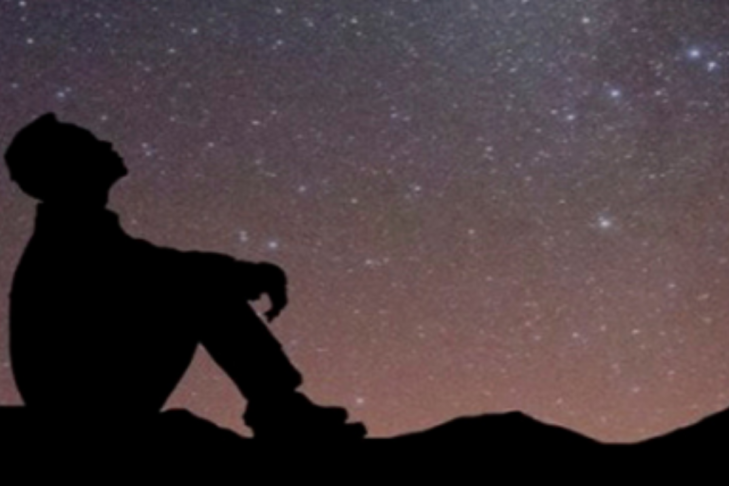 Image of a person stargazing