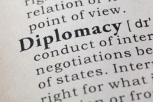 Image of the word diplomacy in bold on a page with other words