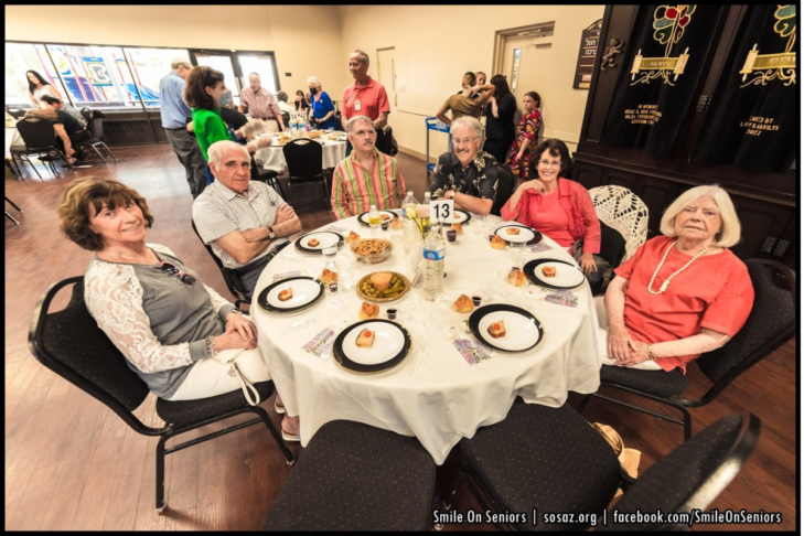 Image of a group of seniors having Shabbat dinner