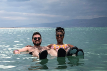 Couple floating in the Dead Sea