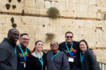 group of hmi participants posing at the western wall