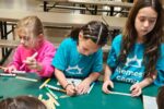Shemesh Campers participate in two small projects as part of Center for Jewish Philanthropy's project for Volunteer Day in July 2024.